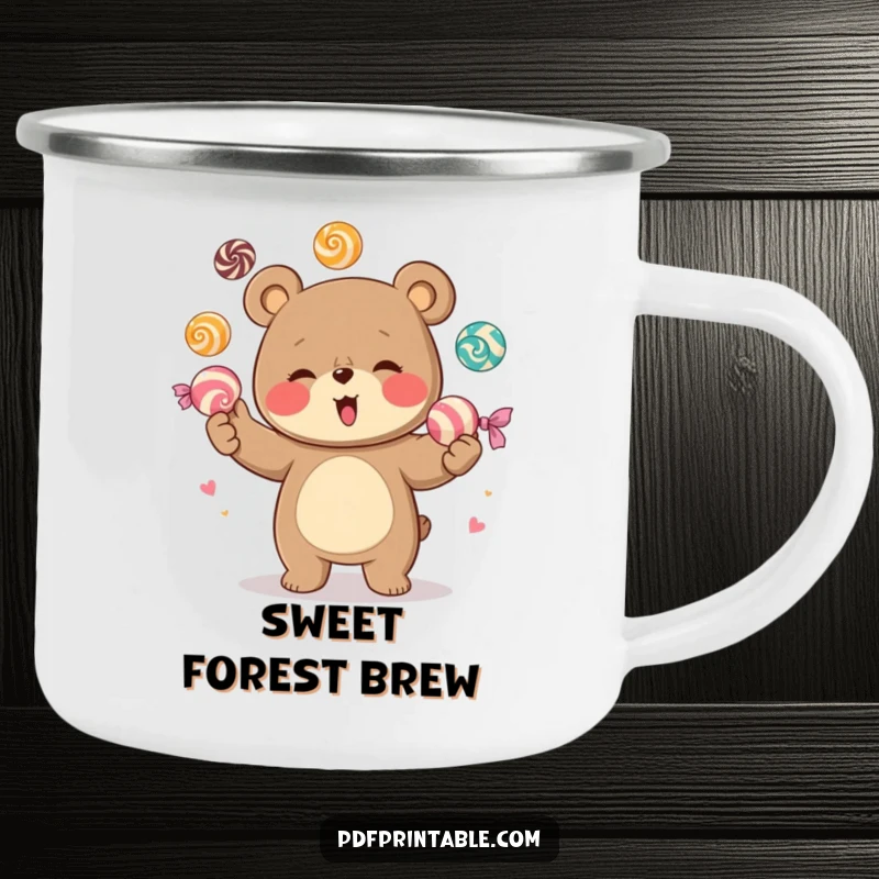 Funny enamel camping mug illustrating a giggling bear character juggling a colorful assortment of large candies, perfect for outdoor enjoyment.