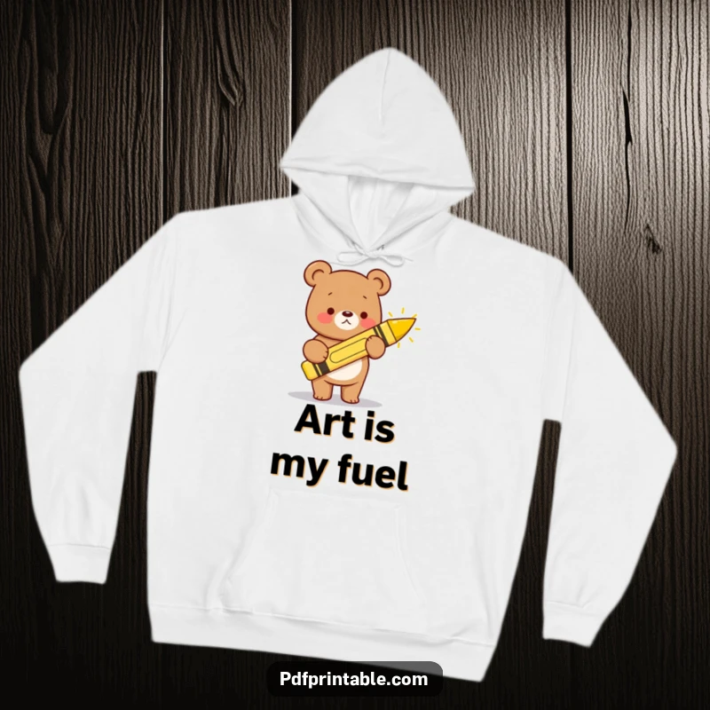 Funny kawaii bear with a large crayon, drawing a happy sun, featured on this warm and cozy hoodie.